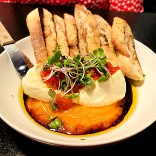 Fresh Mozzarella with carrot puree, grilled Baggett and grape sava