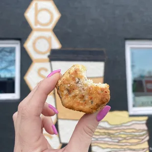 a hand holding a biscuit