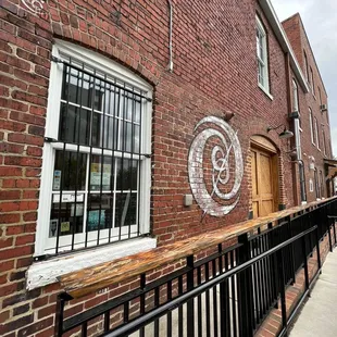 a brick building with graffiti on it