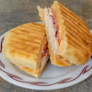 a sandwich cut in half on a plate