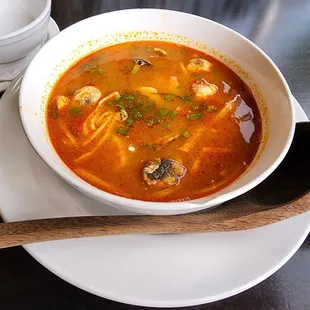 a bowl of soup and a spoon