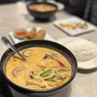 a bowl of thai curry and rice