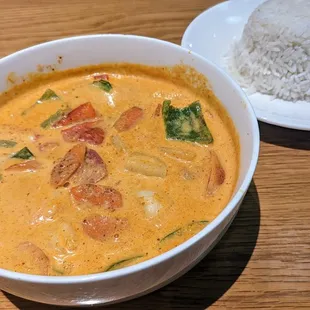 Spicy red curry with bell peppers, eggplant (yum) and basil, with a side of rice.