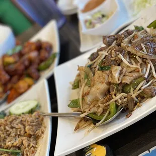 a variety of asian food on plates