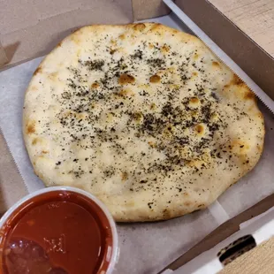 Basil Bread sticks and a side of Signature tomatoe Sauce