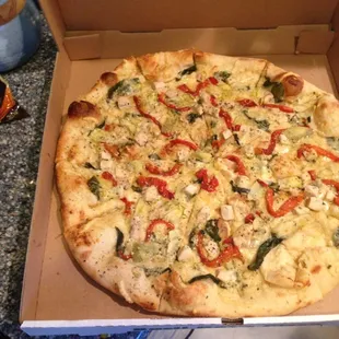 White pizza with garlic, basil, spinach, chicken &amp; artichoke so light and perfect for summer!