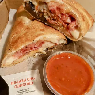Meat Lovers Stromboli with extra cheese and mushrooms,  with sauce