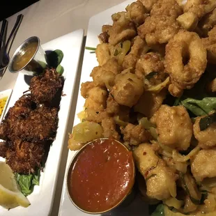 a plate of fried squid and a side of sauce