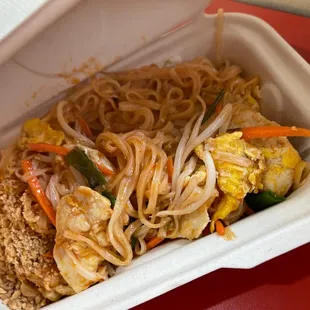 a container of noodles and vegetables