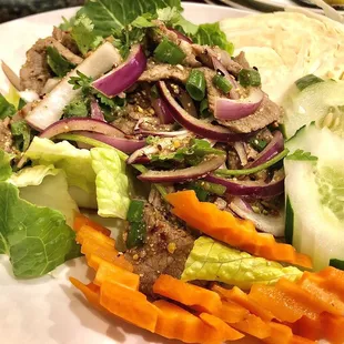 Grilled Beef Salad (A.K.A - Larb Neua), perfectly seasoned and just the right amount of chilies, green onion, purple onion and parsley.