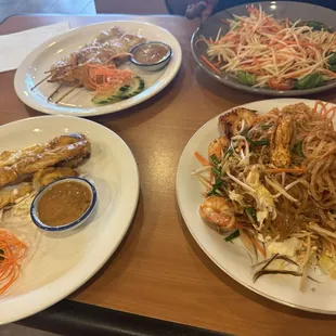Satay chicken, pad thai, papaya salad