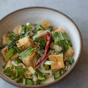 a bowl of stir fried vegetables