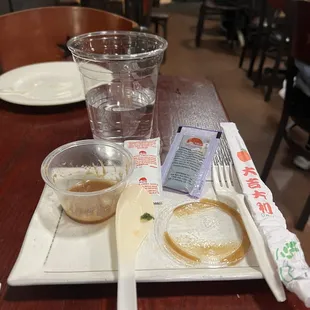Only disposable utensils, cups and condiments provided here at a sit down restaurant
