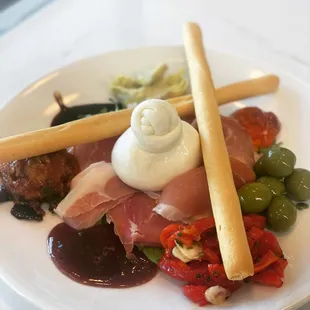 a plate of meat and vegetables