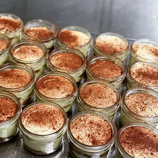 a close up view of small jars of food