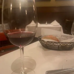a glass of wine on a table
