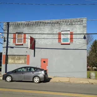 a car parked in front of a building