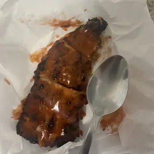 Ribs are so incredibly overpriced. Spoon for scale. This is maybe 6 oz of ribs for $18. I paid $3 an ounce for these ribs. Rip off.