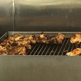 Fire grilled fresh chicken. The smell as soon as you walk in there is great too!