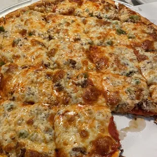 Beautiful pizza with a slice already gone!