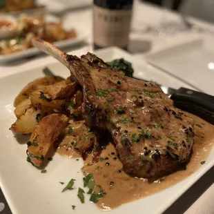 Veal with potatoes and greens.