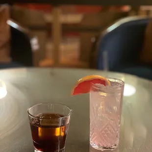 a drink and a glass on a table