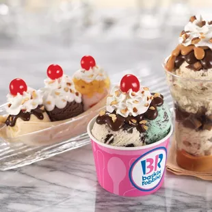 three ice cream sundaes with toppings