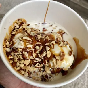 a person holding a bowl of food