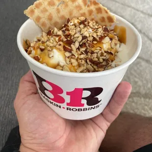 a person holding a bowl of food