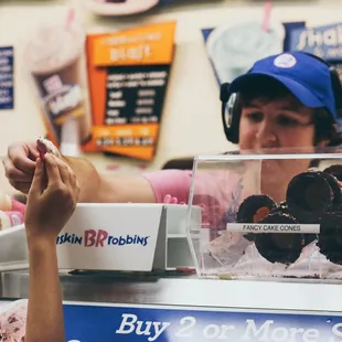 a woman at a donut shop