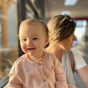 She is all smiles after a small taste of Rainbow Sherbet!