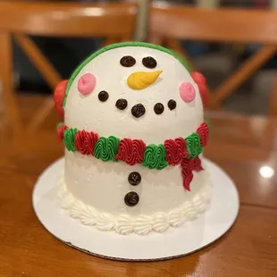 a frosted snowman on a plate