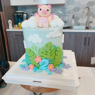 a cake with a pig on top