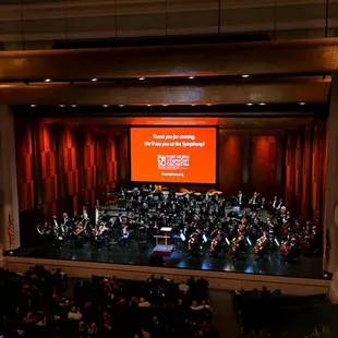 stage with orchestra and audience