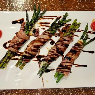 Asparagus Wrapped in Prosciutto drizzled with balsamic reduction sauce