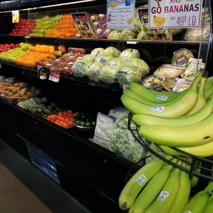 a display of bananas and other fruits
