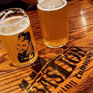 two glasses of beer on a wooden table