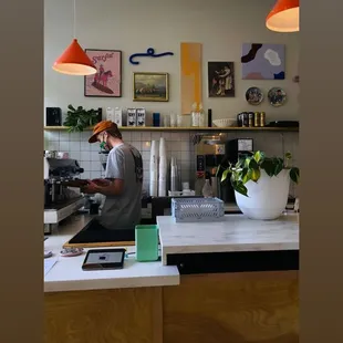 a man working in a coffee shop