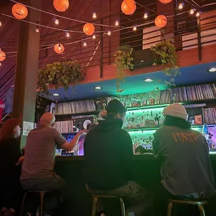 a group of people sitting at a bar