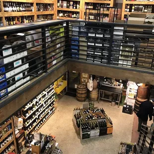 a wine shop with shelves full of bottles of wine