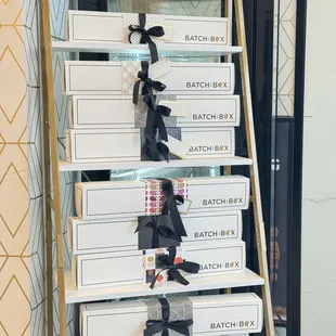 a stack of white boxes with black bows