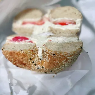 Sesame Bagel w/ cream cheese and tomato.