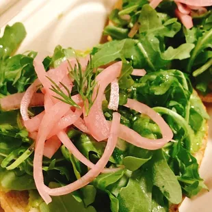 Avocado, arugula, pickled onions bagel
