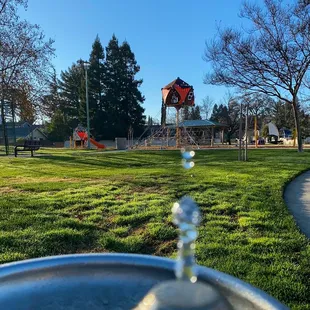 Water fountain and play structure