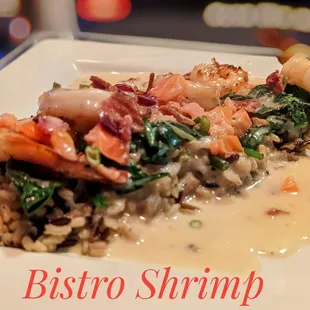 Shrimp with a creamy garlic sauce, spinach, bacon, and rice. Delicious