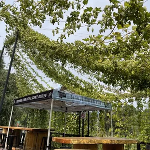 tables and benches under a canopy