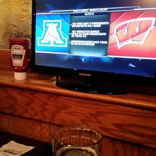 TVs at the table for the game. Awesome!