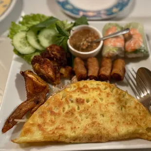 Appetizers combo platter - fried chicken egg rolls, imperial spring roll, rice pancake stuffed and meat stuffed fried chicken wing