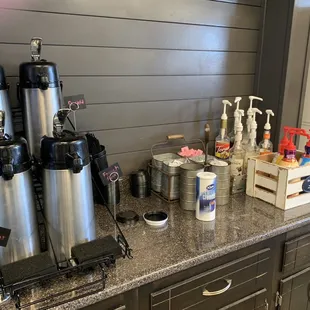 a counter with coffee machines
