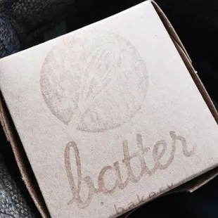 This cute little box contains a carrot cupcake.